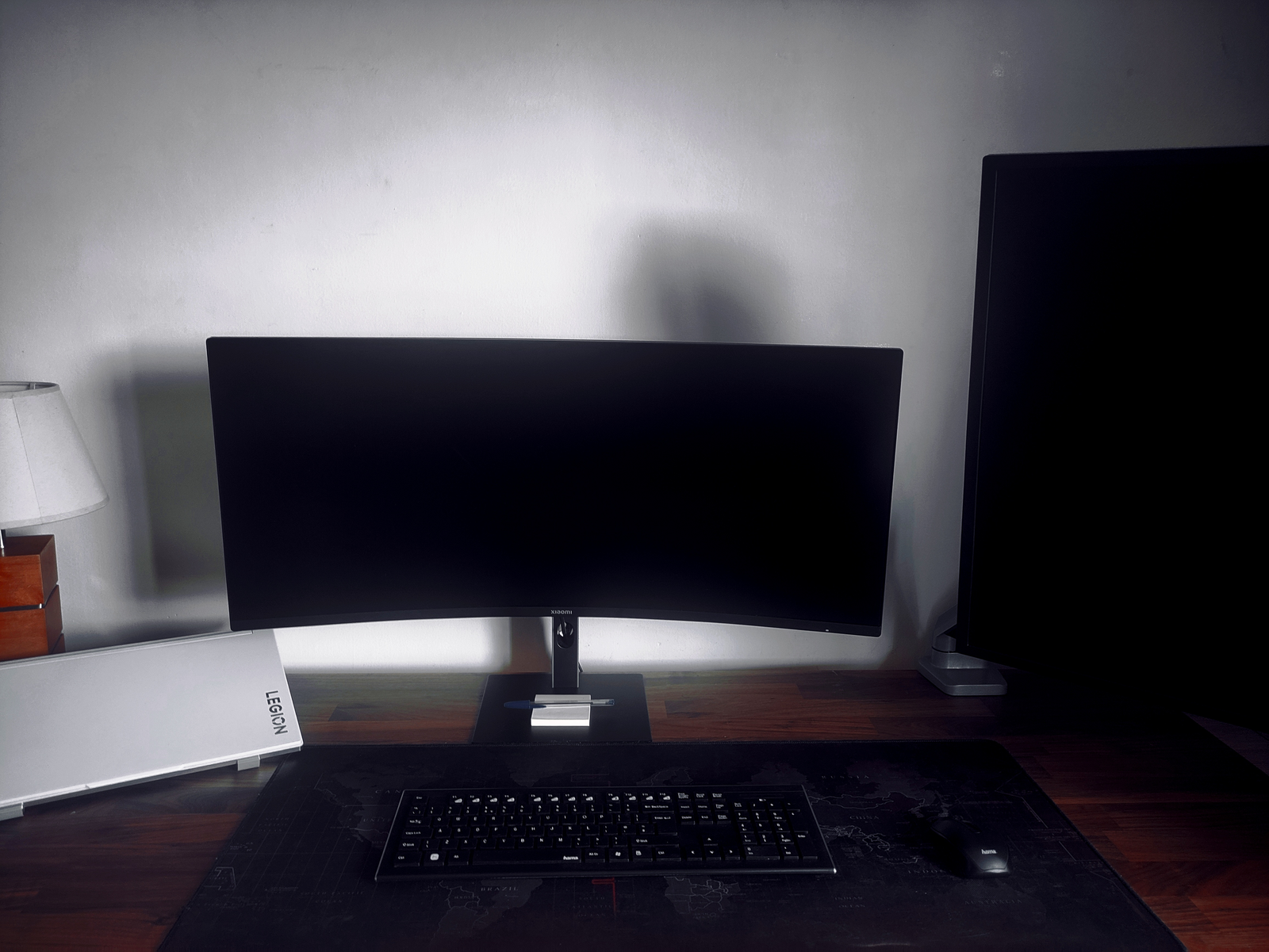 Adrian’s desk setup with ultrawide monitor, vertical secondary display, keyboard, and laptop